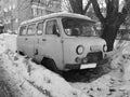 Old non-working car in the snow under a tree Royalty Free Stock Photo