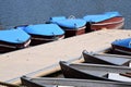 old and nostalgic pedal boats and row boats on a pier Royalty Free Stock Photo