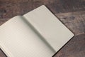 An old notebook with blank pages for text. Located on an old texture table Royalty Free Stock Photo