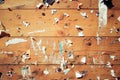 Old notice board with scraps of papers Royalty Free Stock Photo