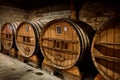 Old oak casks of calvados in a cellar