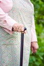 Old obese woman walking with stick Royalty Free Stock Photo