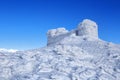 The old observatory covered with textured snow. Winter scenery. Beautiful landscape of high mountains and blue sky. Lawn covered Royalty Free Stock Photo