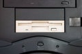 Old obsolete CD DVD write unit in a black vertical vintage PC tower close up shot