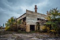 Old obsolete ruined concrete industrial building. Abandoned factory