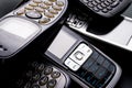 Old and obsoleted cellphones on black background Royalty Free Stock Photo