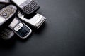 Old and obsoleted cellphones on a black background Royalty Free Stock Photo