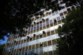 Old office building with rust on the walls and lots of air conditioners on the facade of the building Royalty Free Stock Photo