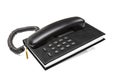 Old office desktop phone with phonebook Royalty Free Stock Photo