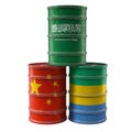 Old Oil Drums with Saudi Arabia, Gabon and China national flags. Royalty Free Stock Photo