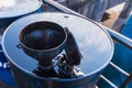 Old oil funnel on rusty metal oil barrels at shipyard.Phuket.Thailand