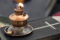 Real old oil lamp on a bible blurry background Royalty Free Stock Photo