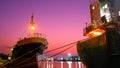 The old oil tanker ships moored in shipyard area at harbor during maintenance work against colorful twilight sky background Royalty Free Stock Photo