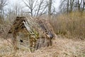 Old old dilapidated little wooden abandoned ruined broken village house of beams, logs and sticks Royalty Free Stock Photo