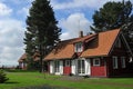 Old old wooden house, red, in the European country of Lithuania, in the spa town of Nida, on the Curonian Spit Royalty Free Stock Photo