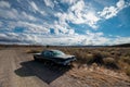 Old Oldsmobile 88 Car in the sunny Nevada Desert with blue cloudy sky