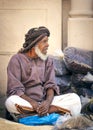 Old omani man selling dry fish at a market in Nizwa