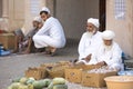 Old omani men selling their produce at a street market