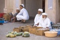 Old omani men selling their produce at a street market