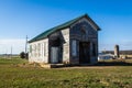 An old one room school house against the blue cloudless sky Royalty Free Stock Photo