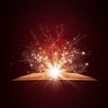 Old open book with magic light and falling stars Royalty Free Stock Photo