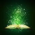 Old open book with magic light and falling stars Royalty Free Stock Photo