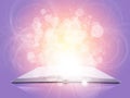 Old open book with magic light and falling stars Royalty Free Stock Photo