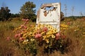 An old open door in a meadow opens the way to a long forgotten land Royalty Free Stock Photo