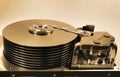 Old open hard disk drive. Stack of ten platters and magnetic heads inside. Royalty Free Stock Photo