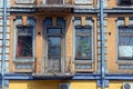 Old open balcony with a door and windows on the brick wall of the house Royalty Free Stock Photo