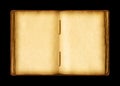 Old open medieval book with worn parchment pages. Isolated on black background Royalty Free Stock Photo