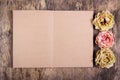 Old open personal diary with empty sheets and withered roses. Dead roses and an old book. Royalty Free Stock Photo