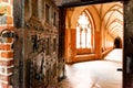 Old open wooden door with carved pattern and metal knob in a medieval castle Royalty Free Stock Photo