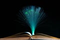 Old opened book , led ambient light in the background. Royalty Free Stock Photo
