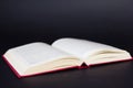 Old openrd book on black color background Royalty Free Stock Photo