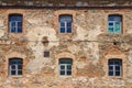 Old orange brick wall with six windows Royalty Free Stock Photo