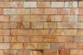 Old orange brick wall, texture of orange stone blocks closeup. Wall texture Royalty Free Stock Photo