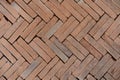 Old orange bricks floor with zigzag pattern texture background Royalty Free Stock Photo