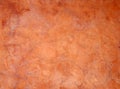 Old orange brown painted faded stained cracked rough plaster wall background Royalty Free Stock Photo