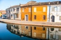 Old orange building water reflection