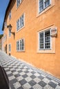 Old orange house on the Mostecka street in Prague