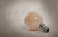 Old orange lightbulb isolated on a white background Royalty Free Stock Photo