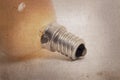 Old orange lightbulb isolated on a white background Royalty Free Stock Photo