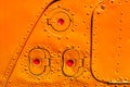 Old orange painted aircraft fuselage part. Royalty Free Stock Photo