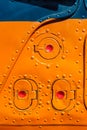 Old orange painted aircraft fuselage part. Royalty Free Stock Photo