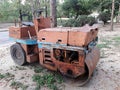 Old orange road roller is dirty. Can not drive
