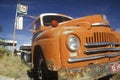 An old orange truck roadside off of Route 66 Arizona