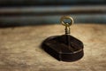 Old original golden key inside a brown metal padlock