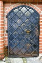 Old ornamental black metal door