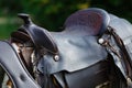 Old ornamental saddle on the wooden fence Royalty Free Stock Photo